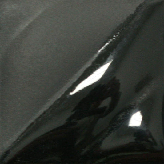 Amaco V-361 Jet Black underglaze on a test tile, satin dark grey area beside a glossy black area