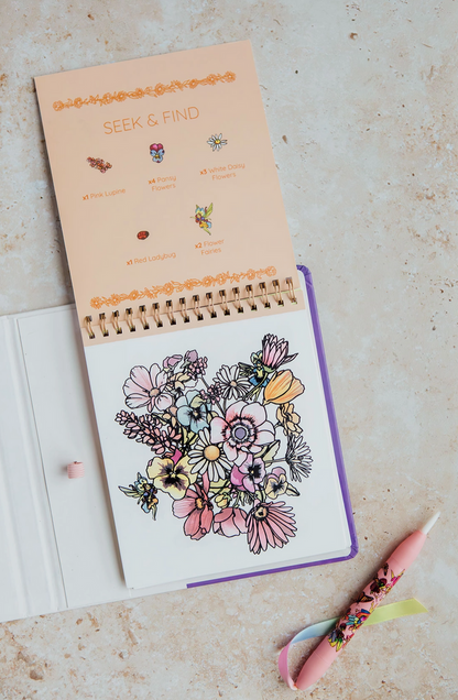 Coloring book with floral design on a light surface