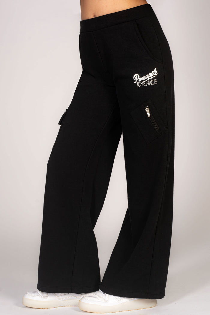 Wide leg cargo joggers in black for kids with large pockets and a dance print on hip.