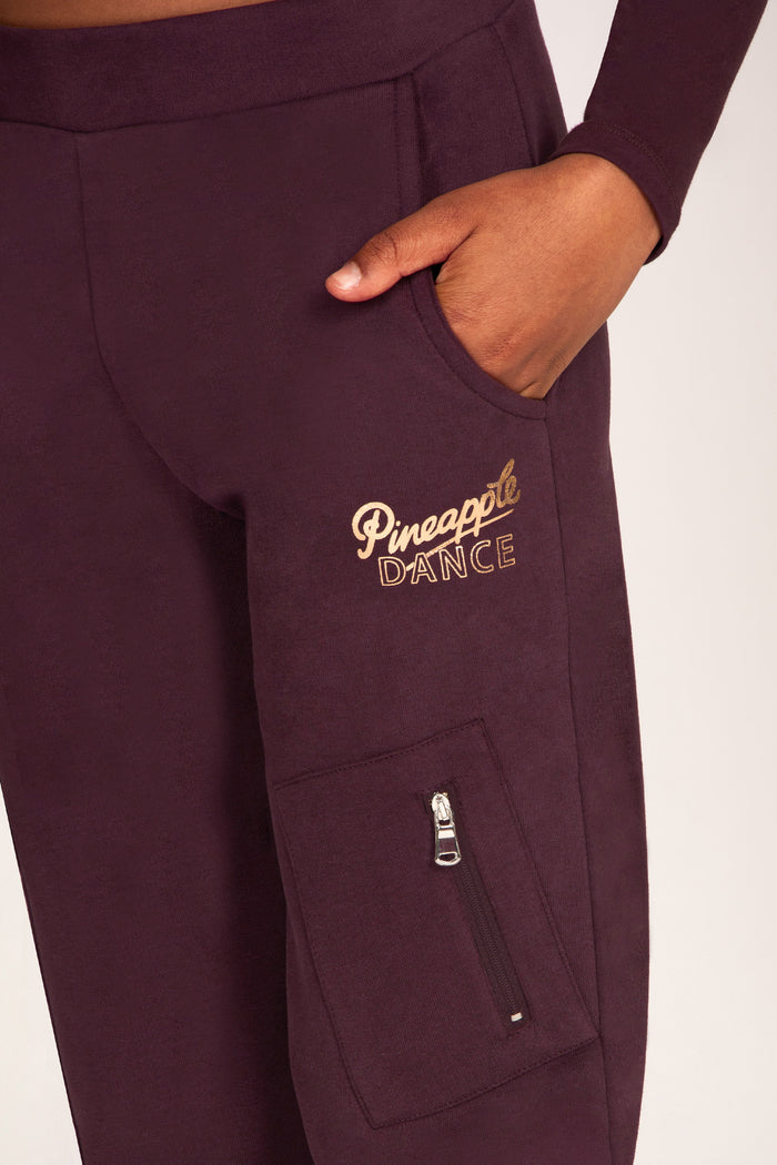 Maroon brown trousers with pockets and rose-gold foil 'Pineapple Dance' print