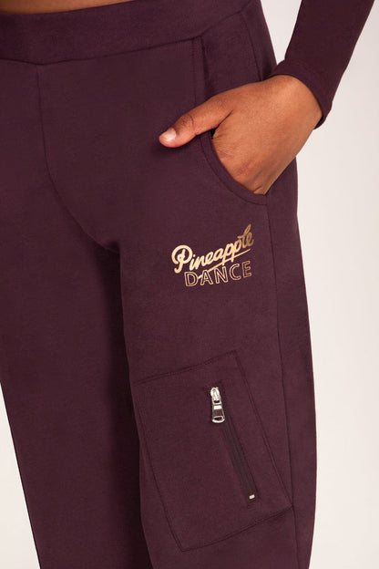 Maroon brown trousers with pockets and rose-gold foil 'Pineapple Dance' print